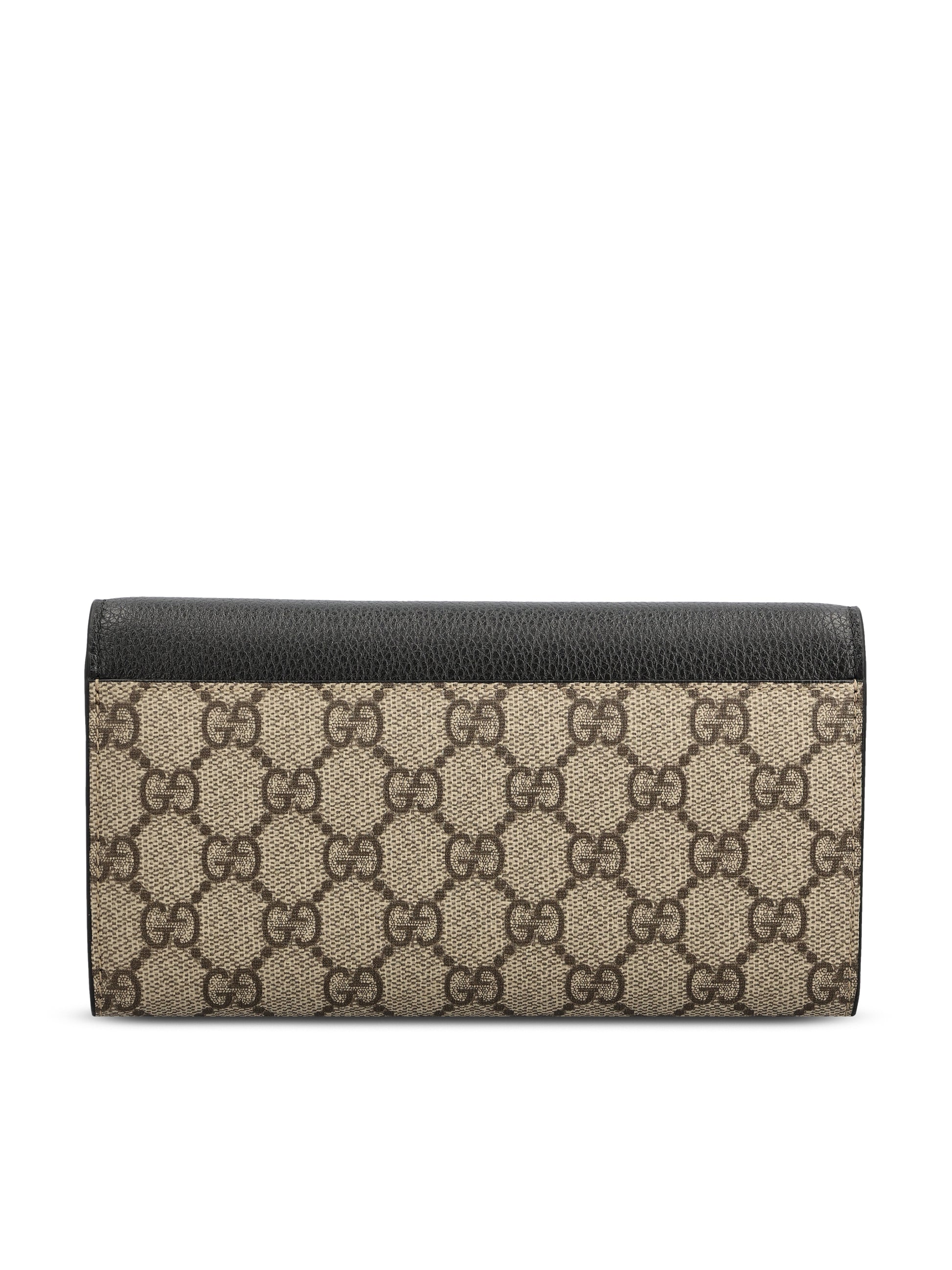 Portafoglio realizzato in pelle e tessuto. 456116 AAE5E1069 GUCCI 