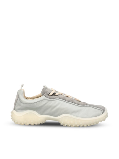 Sneakers realizzate in tessuto e cuoio. 5E806E 3M0KF0424 MIU MIU 