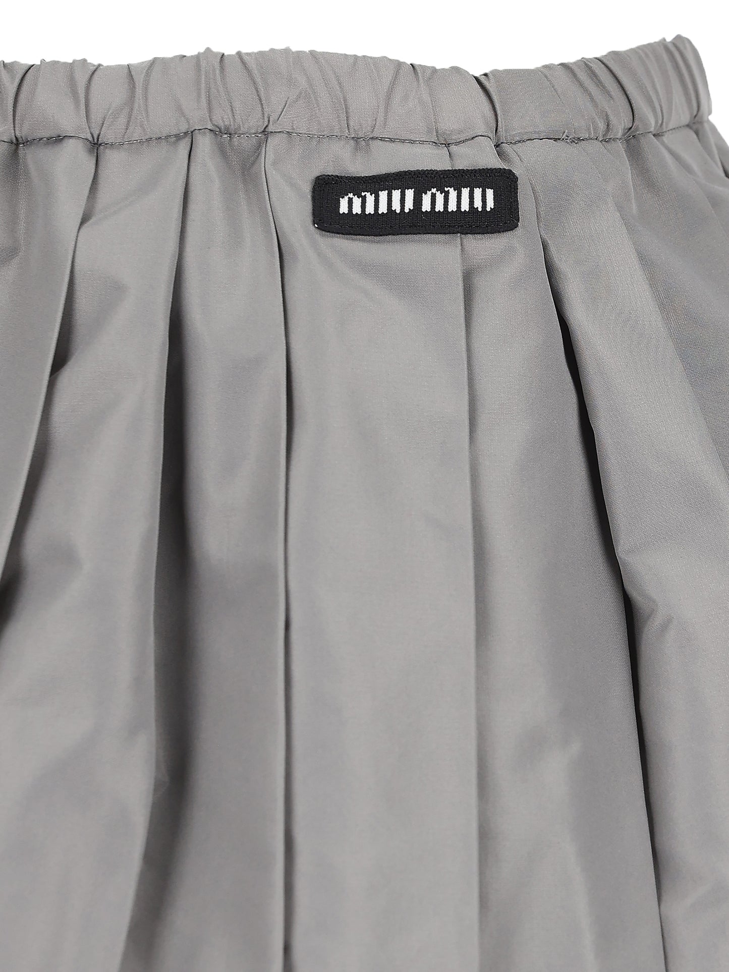 Minigonna realizzata in poliestere. MG2723 121IF0112 MIU MIU 