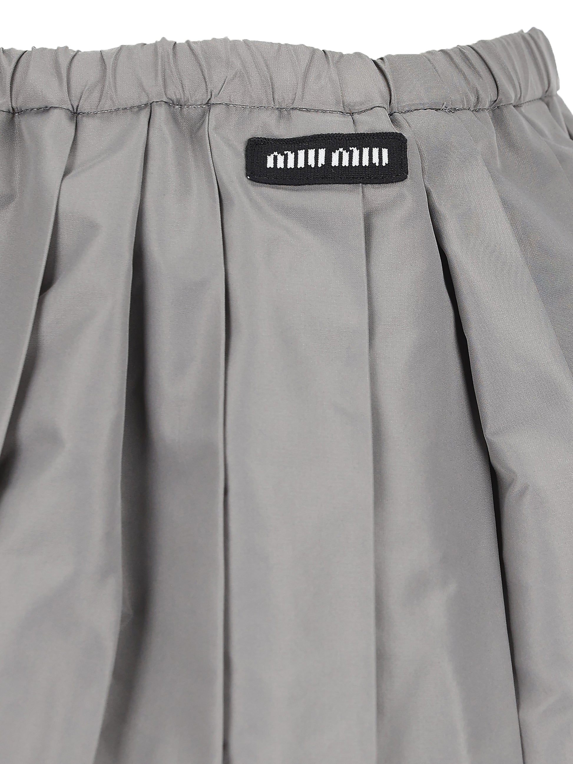 Minigonna realizzata in poliestere. MG2723 121IF0112 MIU MIU 
