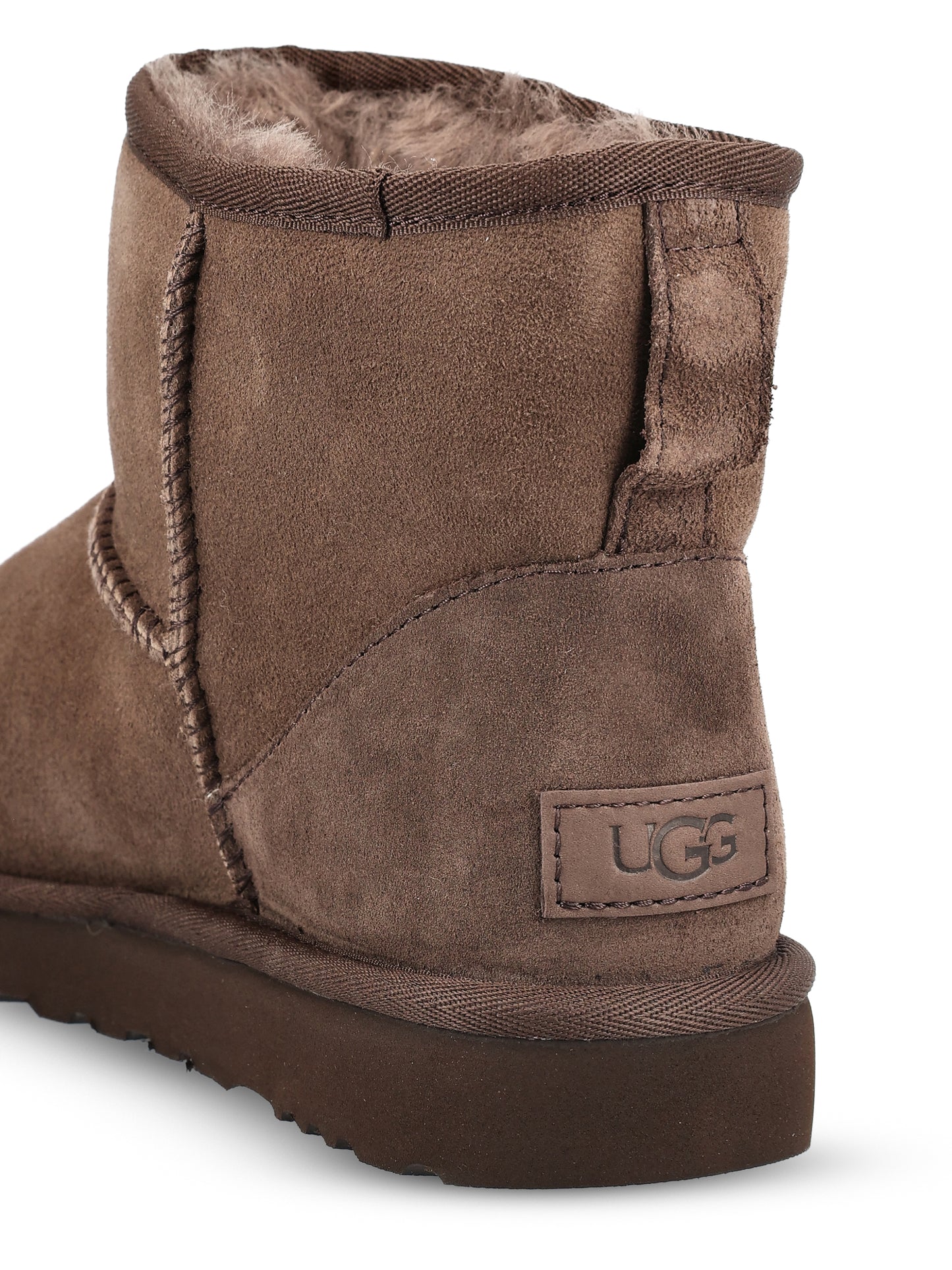 Stivali realizzati in montone e pelle. 1016222 DDC UGG 