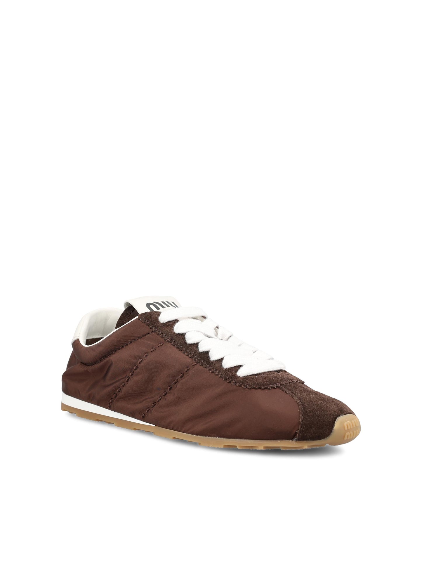 Sneakers realizzate in tessuto tecnico e pelle. 5E114E D7CF0038 MIU MIU 