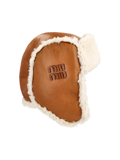 Cappello realizzato in pelle e shearling. 5HC398 2CTTF036S MIU MIU 