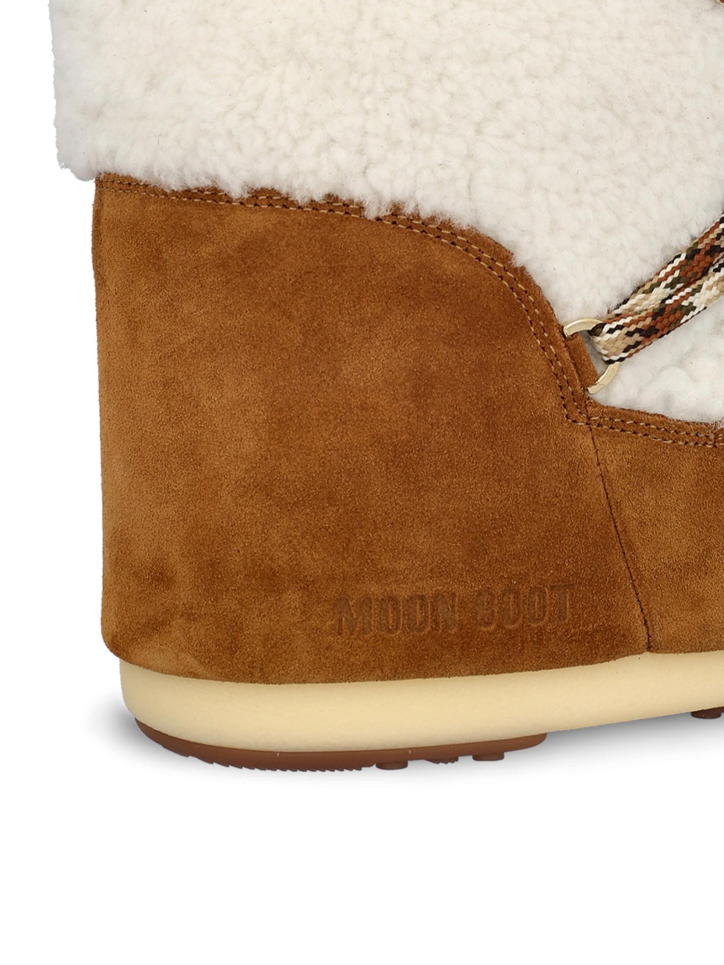 Stivale realizzato in pelle scamosciata e shearling. 80D1402610 MA03 MOON BOOT 