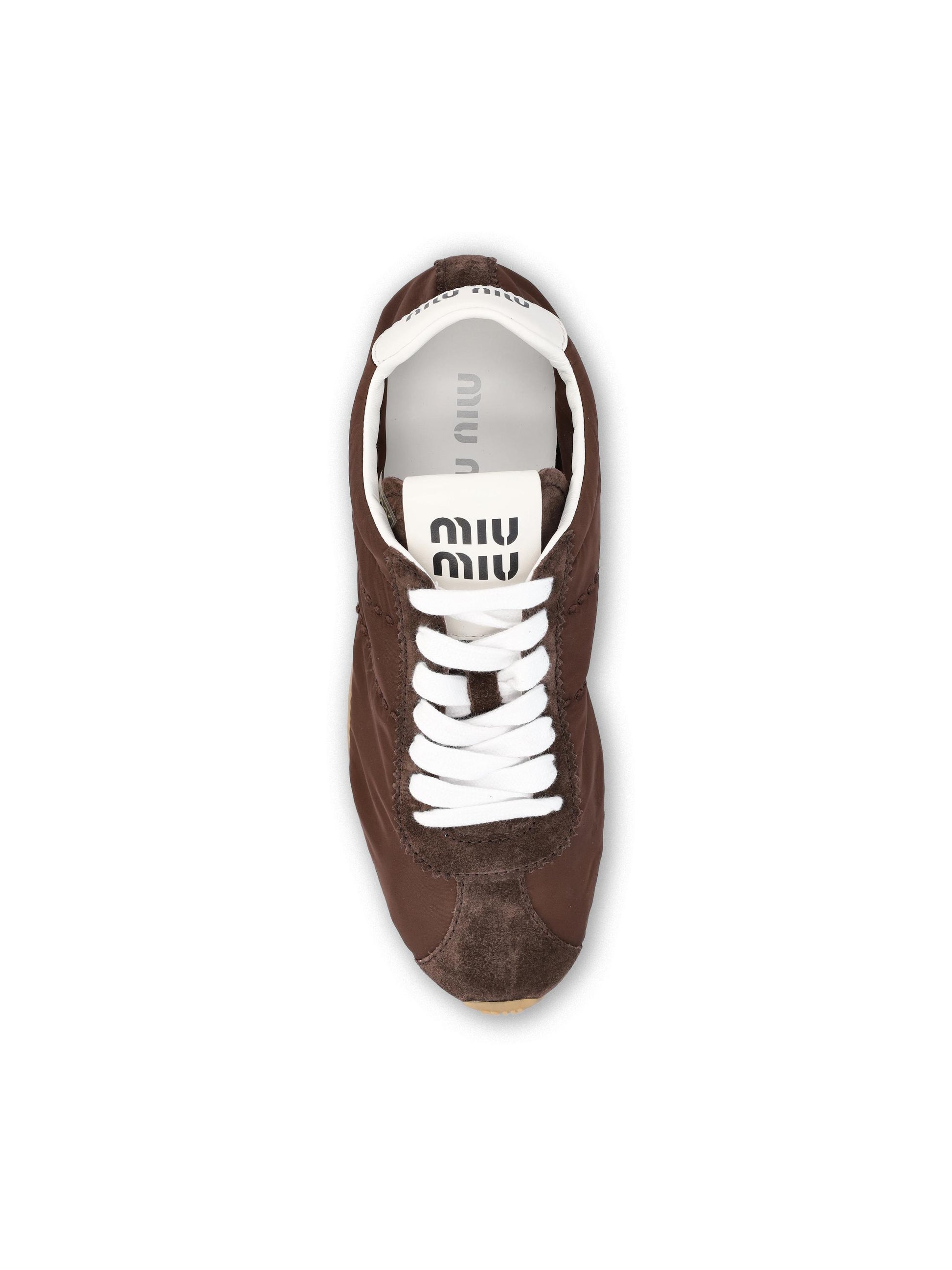 Sneakers realizzate in tessuto tecnico e pelle. 5E114E D7CF0038 MIU MIU 