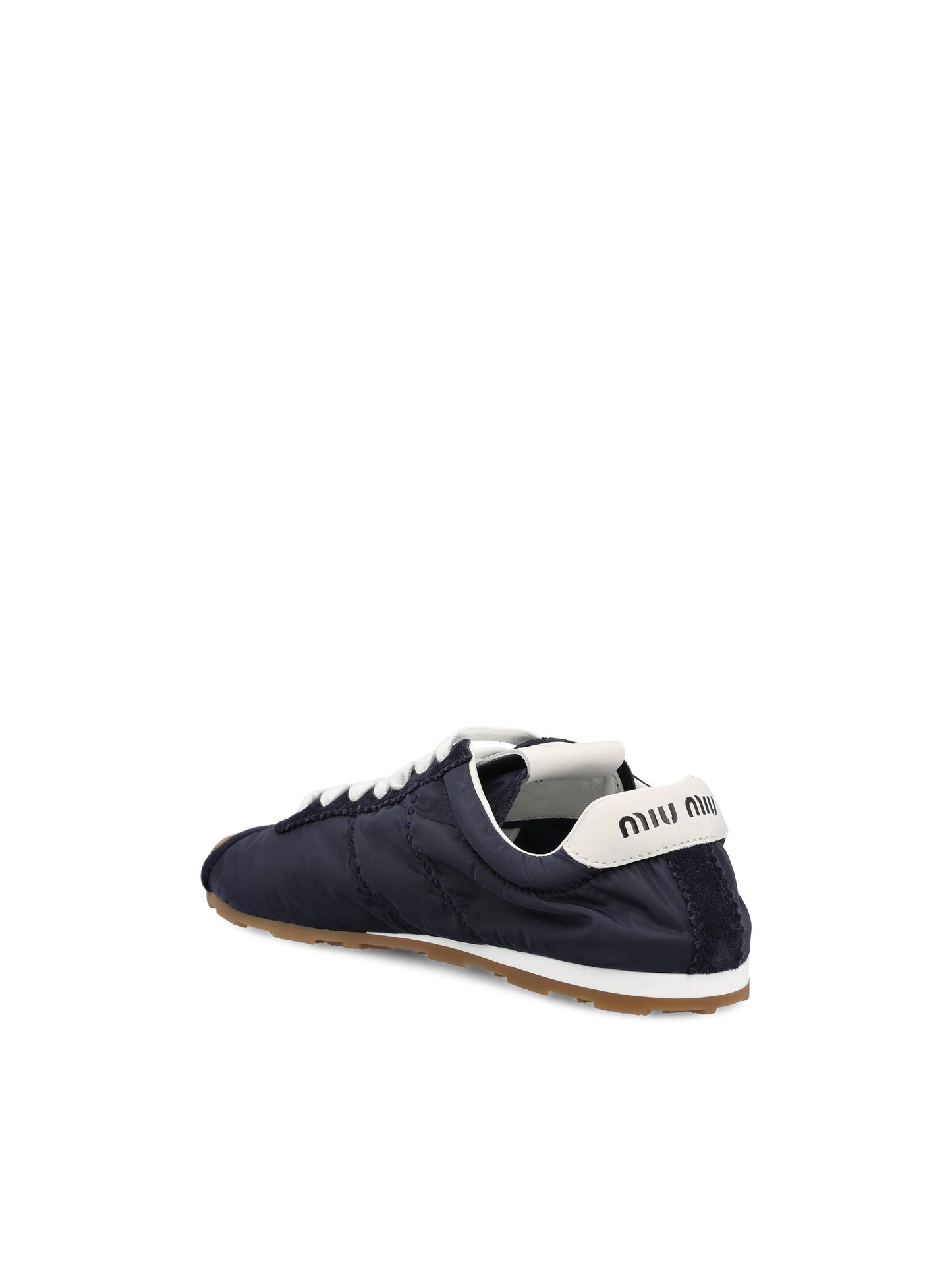 Sneakers realizzate in tessuto tecnico e pelle. 5E114E D7CF0008 MIU MIU 