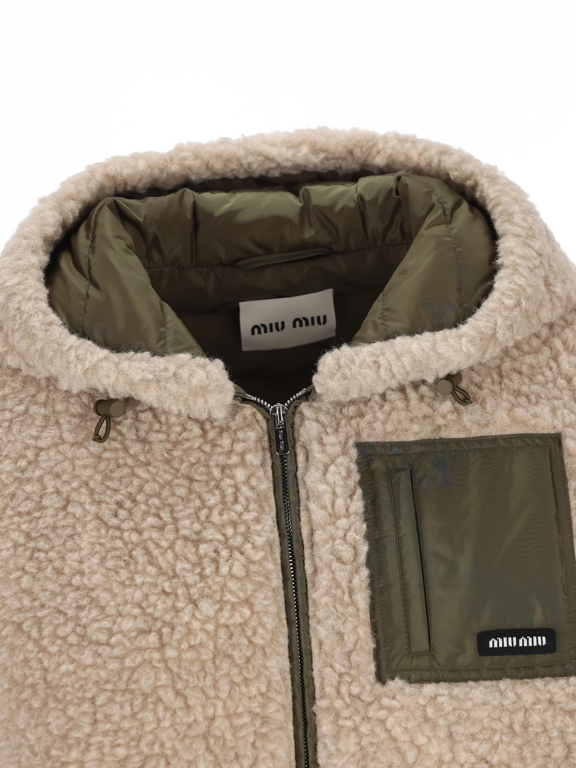 Piumino realizzato in lana vergine e poliestere riciclato. ML1376 18S9F03QQ MIU MIU 