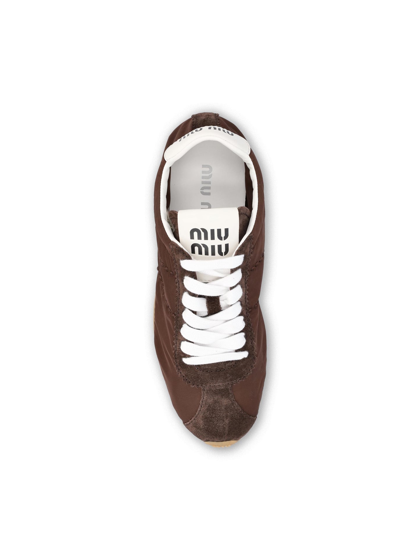Sneakers realizzate in tessuto tecnico e pelle. 5E114E D7CF0038 MIU MIU 